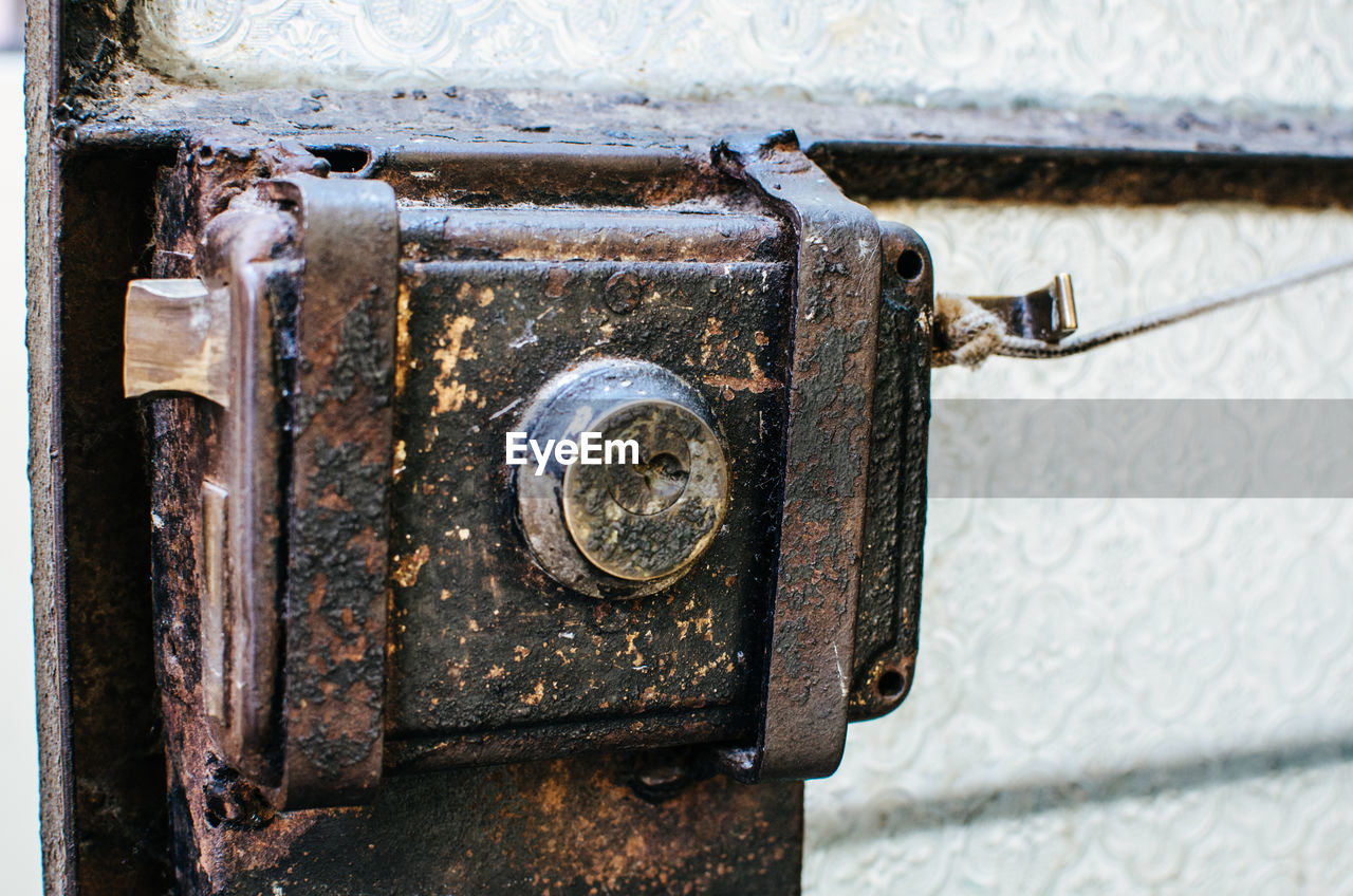 Close-up of old rusty metal door lock