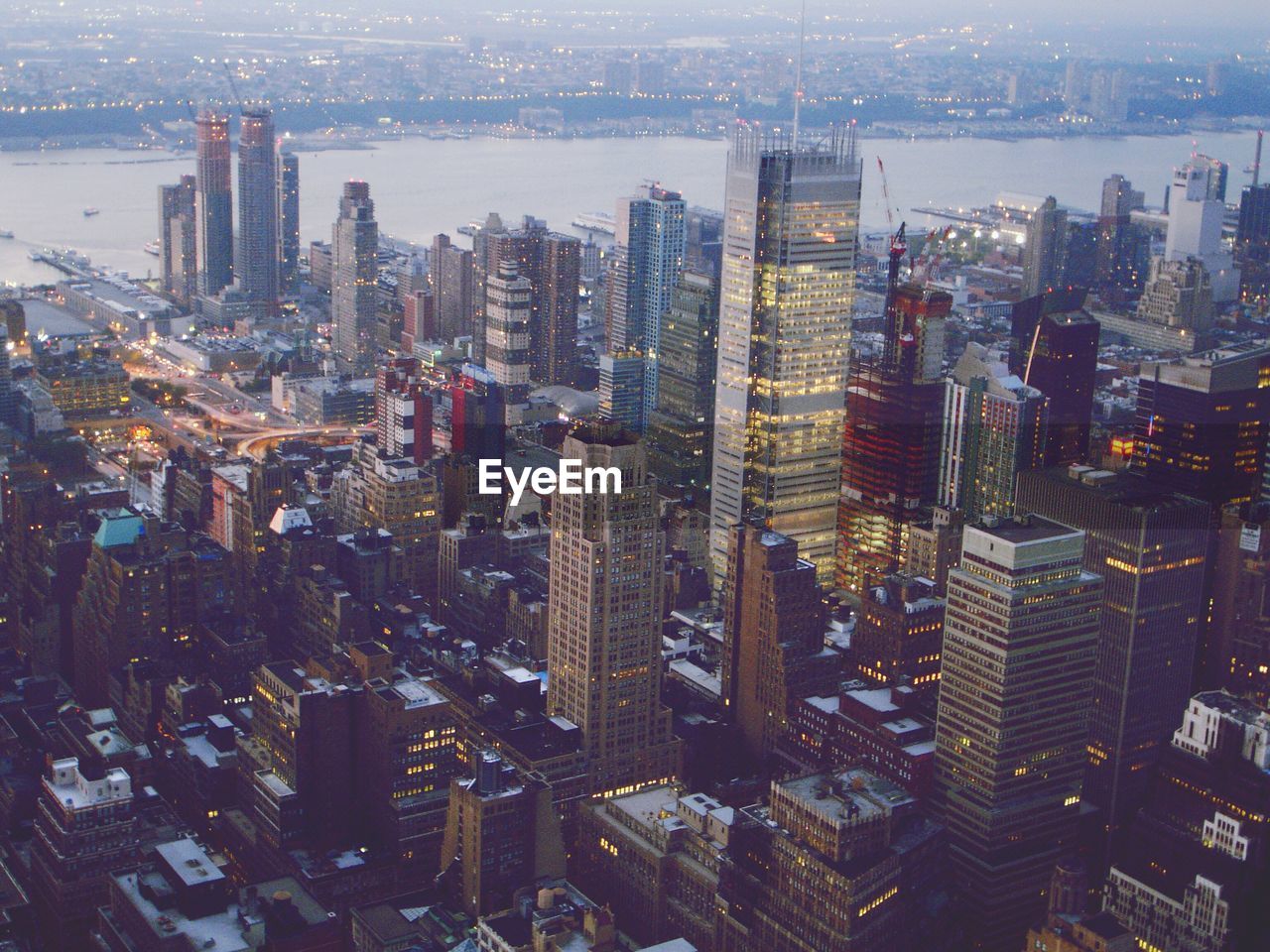 High angle shot of cityscape against river