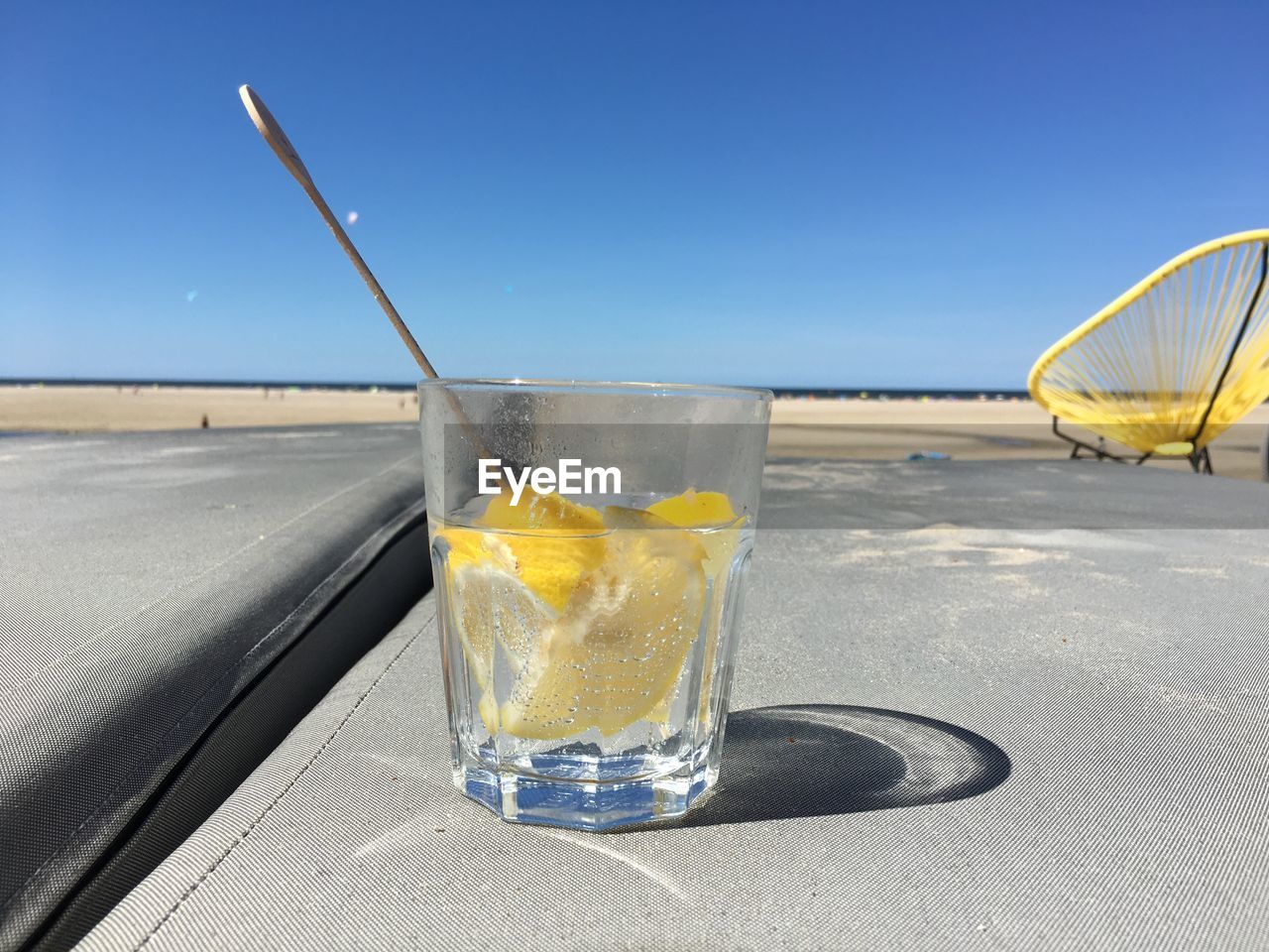 Close-up of drink on table against sky