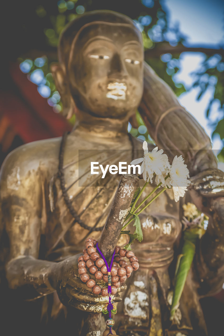 Low angle view of statue at temple