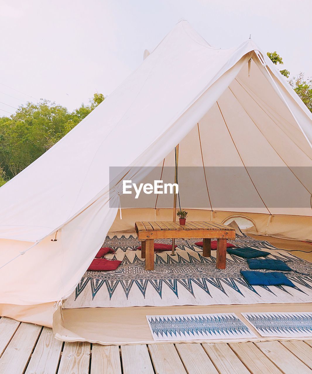 LOW ANGLE VIEW OF TENT AGAINST BUILDING