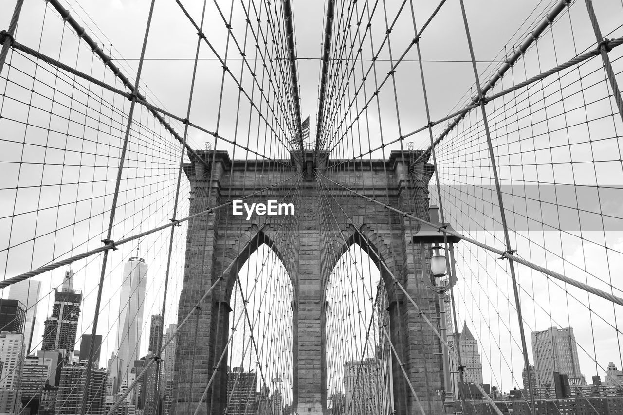 Low angle view of brooklyn bridge against sky