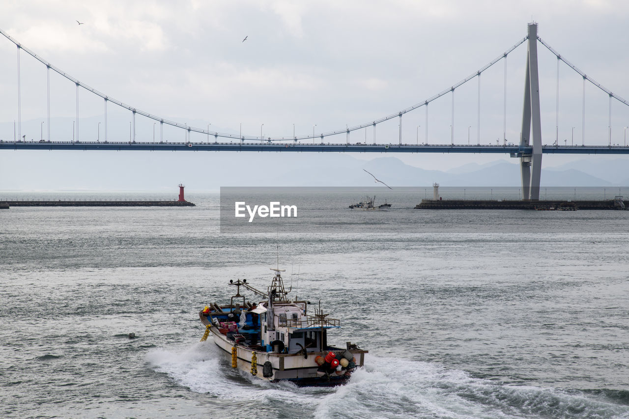 View of suspension bridge over sea