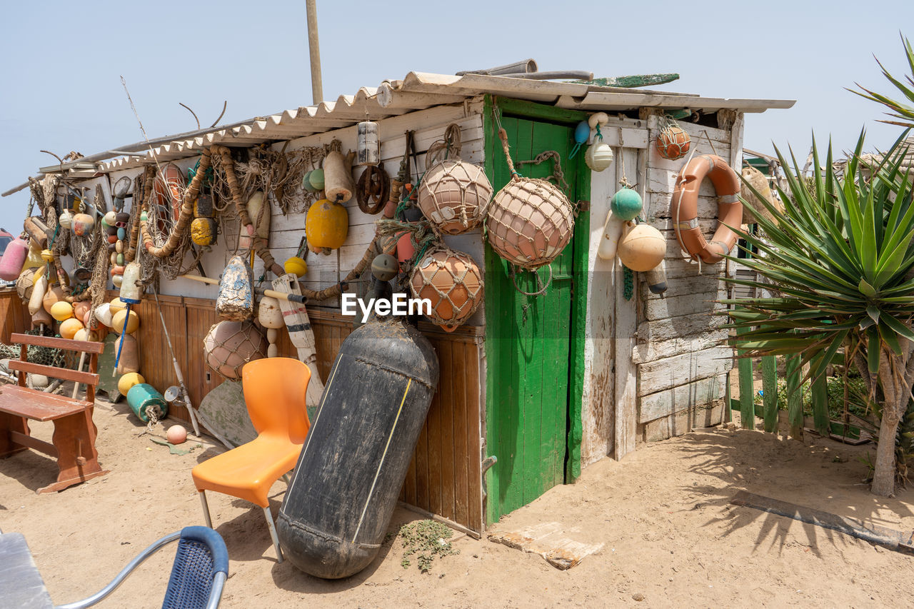 Clothes drying on beach against sky