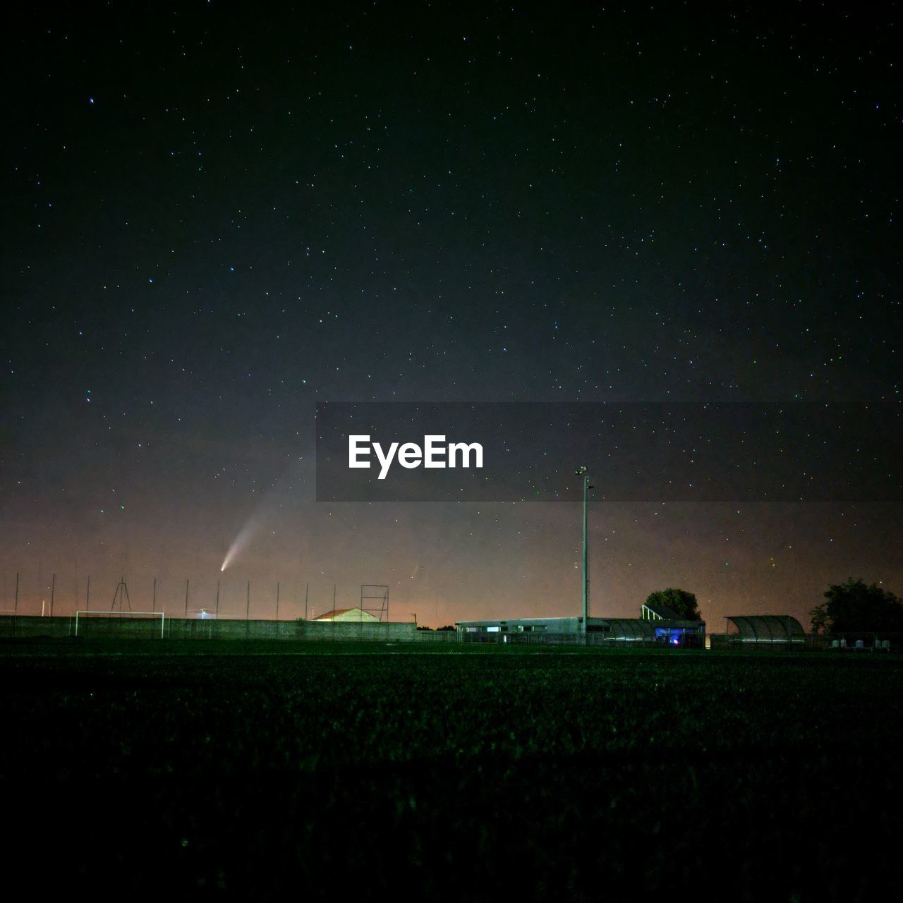 Scenic view of field against sky at night