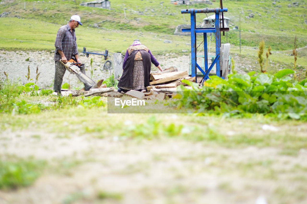 MAN WORKING IN FIELD