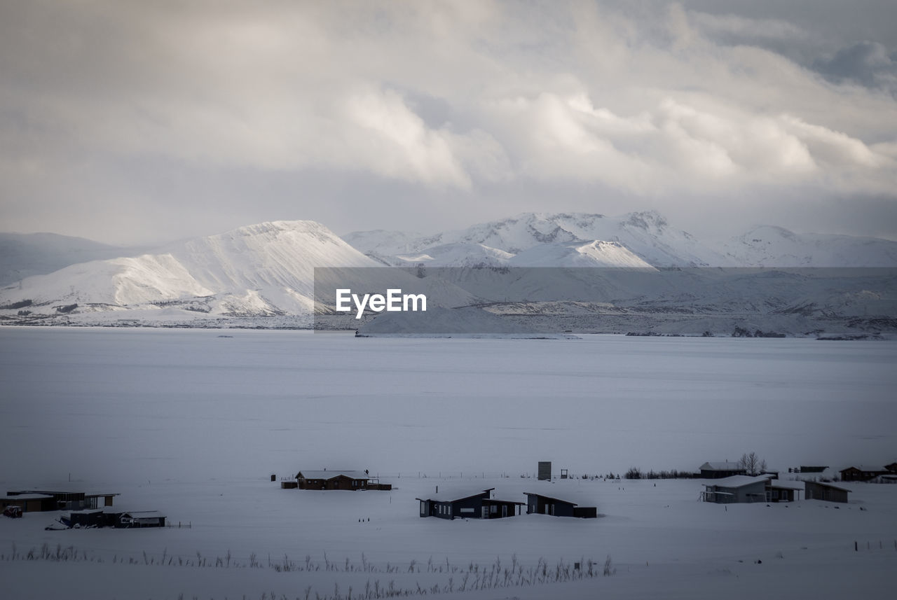 Scenic view of frozen lake against sky