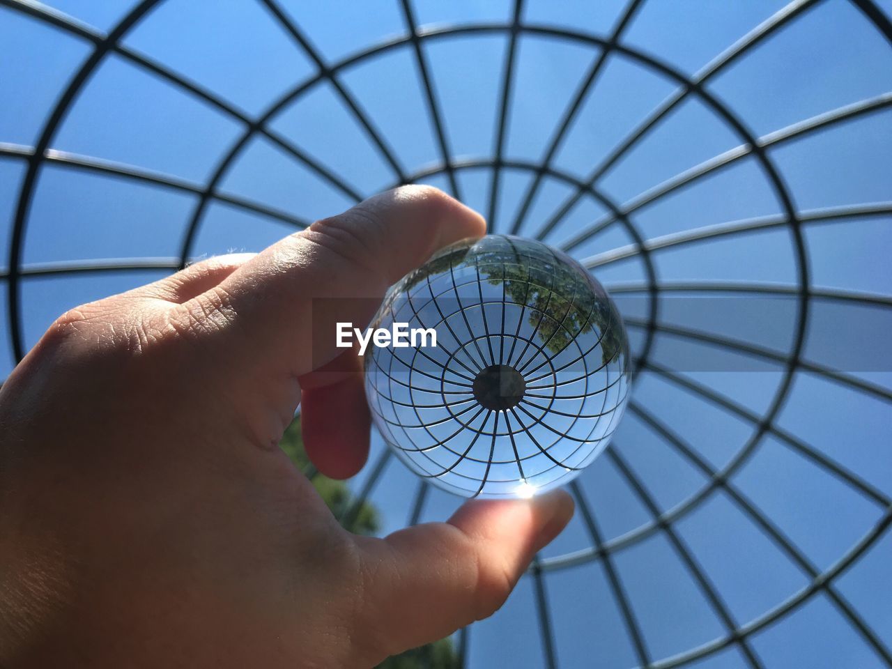 Looking at a gazebo roof through a lensball 