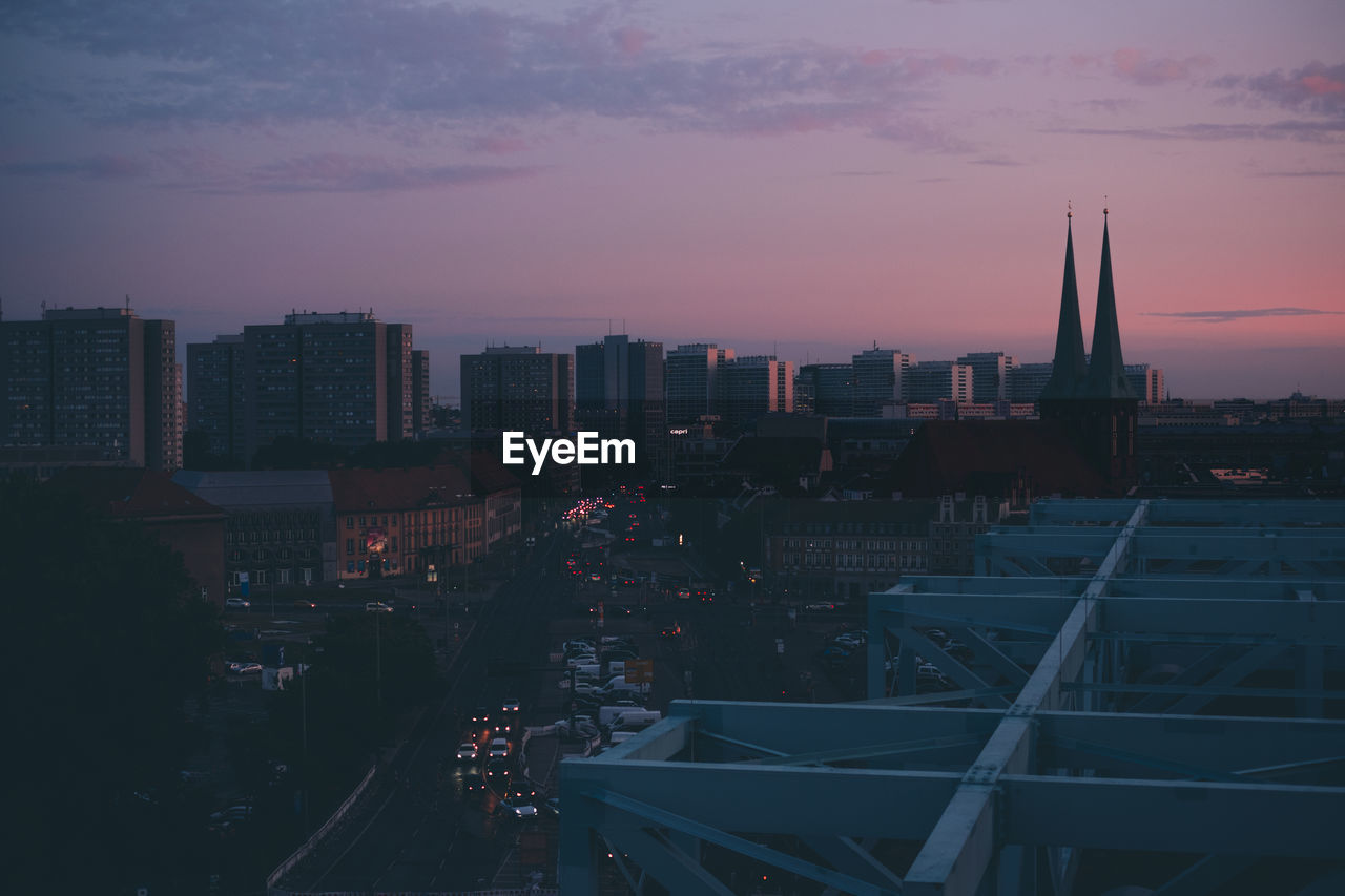 High angle view of city buildings during sunset