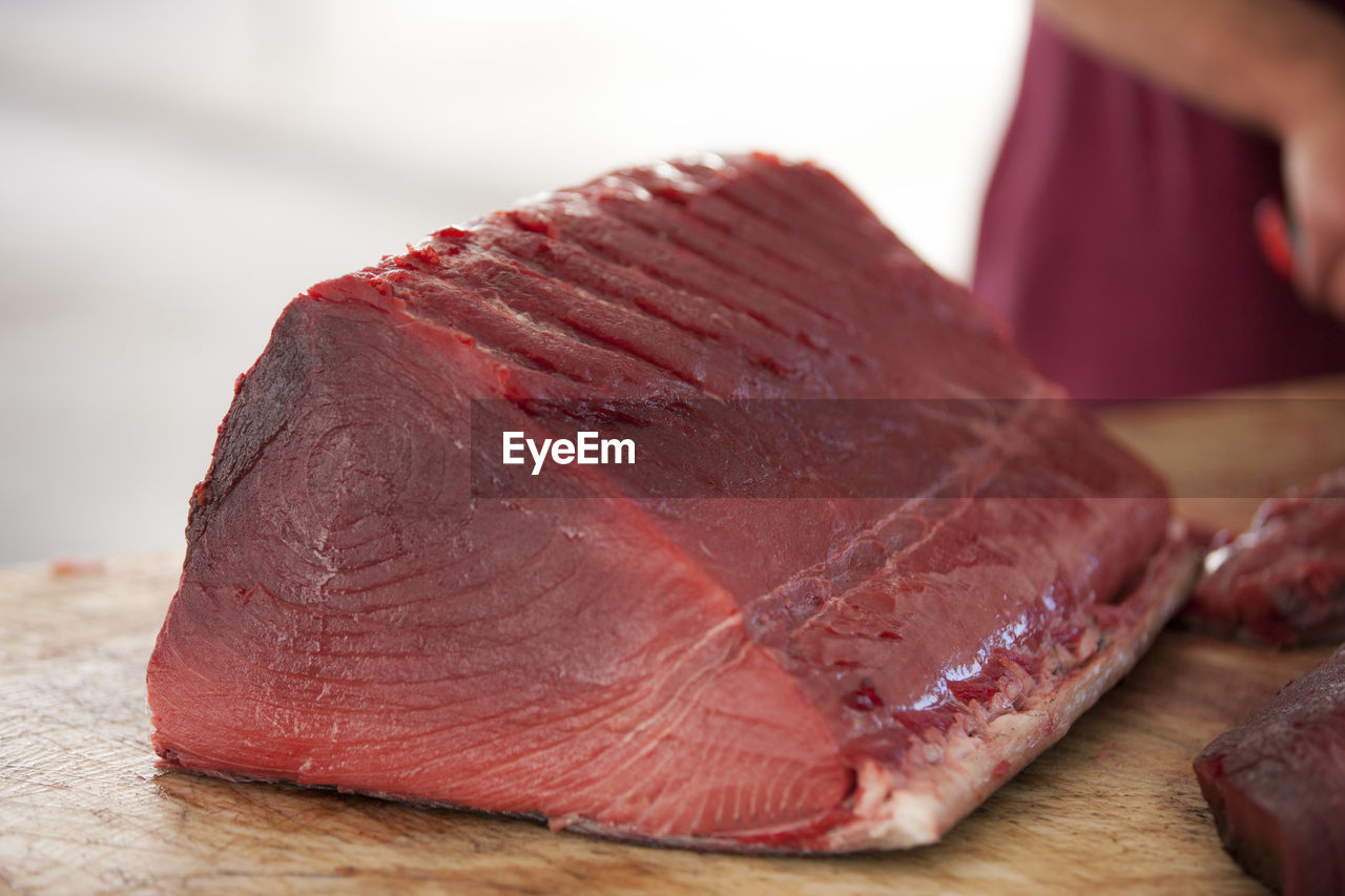 Close-up of tuna fish on cutting board