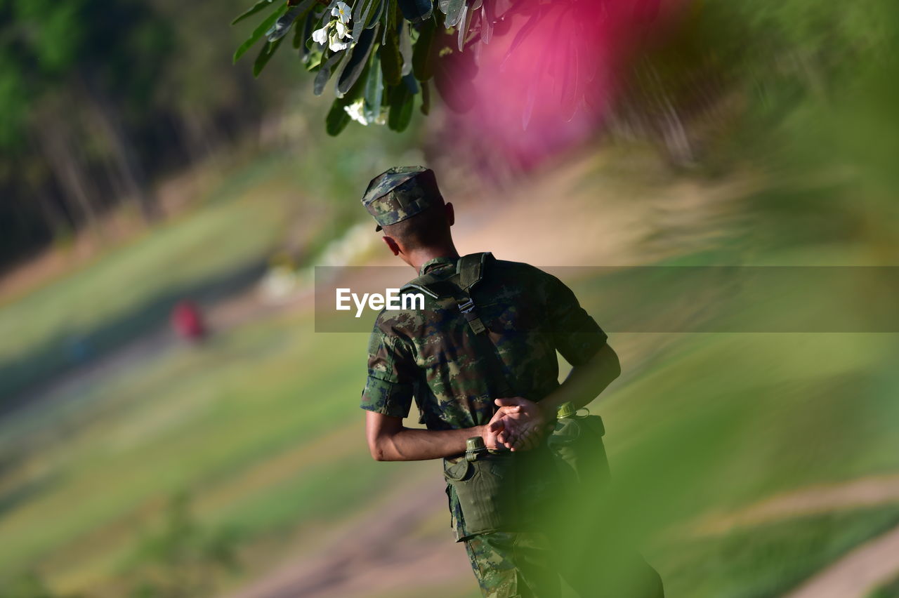 Rear view of soldier standing on land