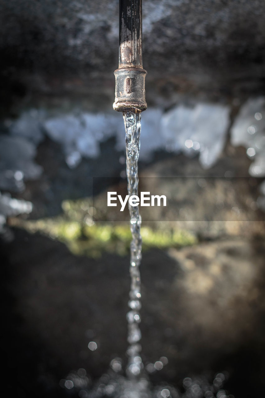 Directly above shot of water coming out from pipe