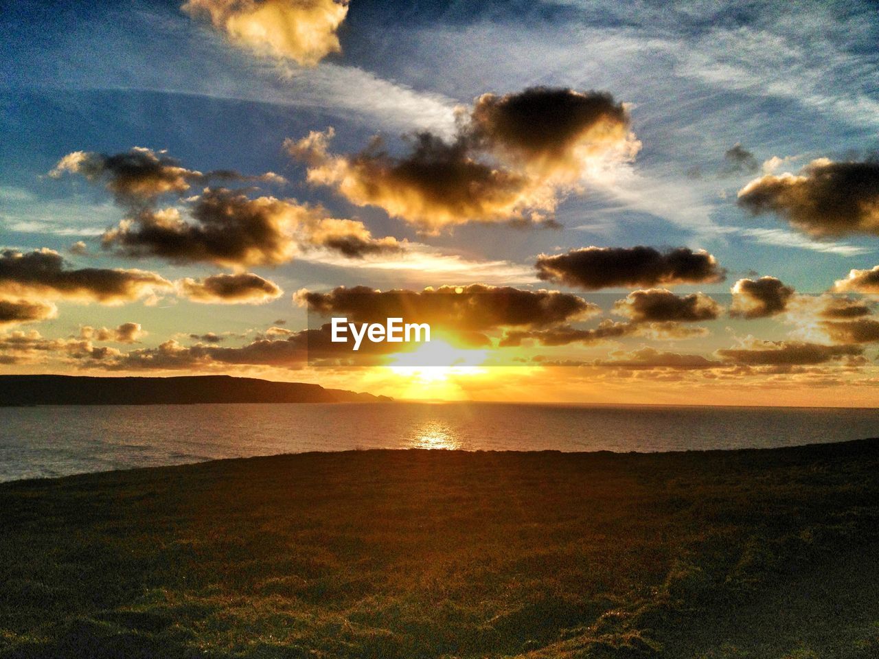 Scenic view of sea against sky during sunset