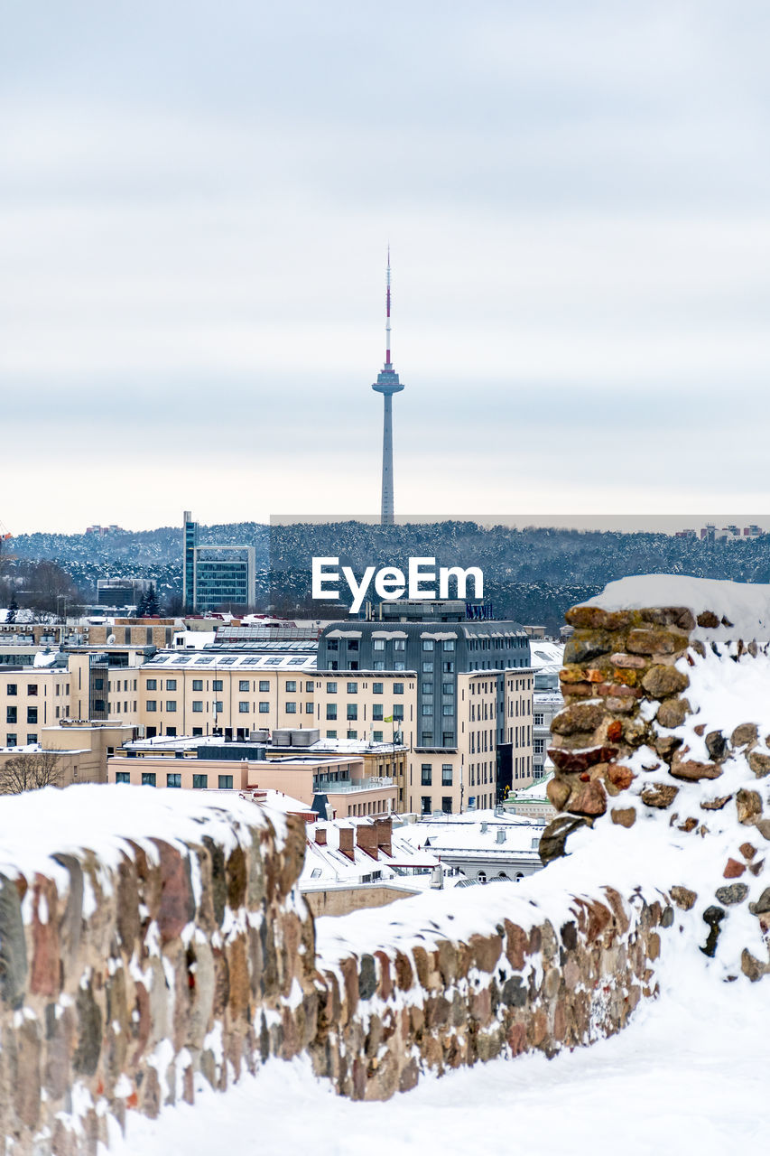 Vilnius city view with tv tower on background in winter day with snow, view form the castle