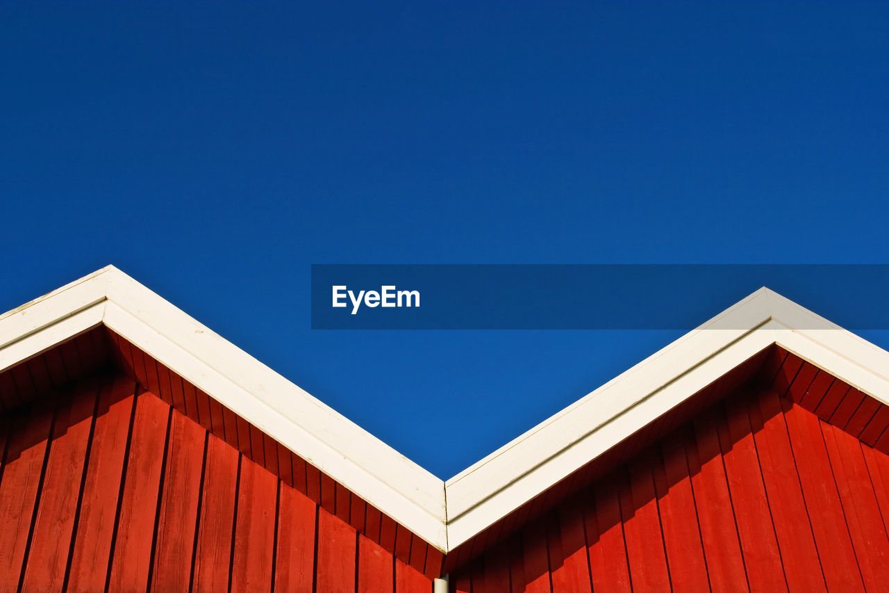 Houses against clear blue sky