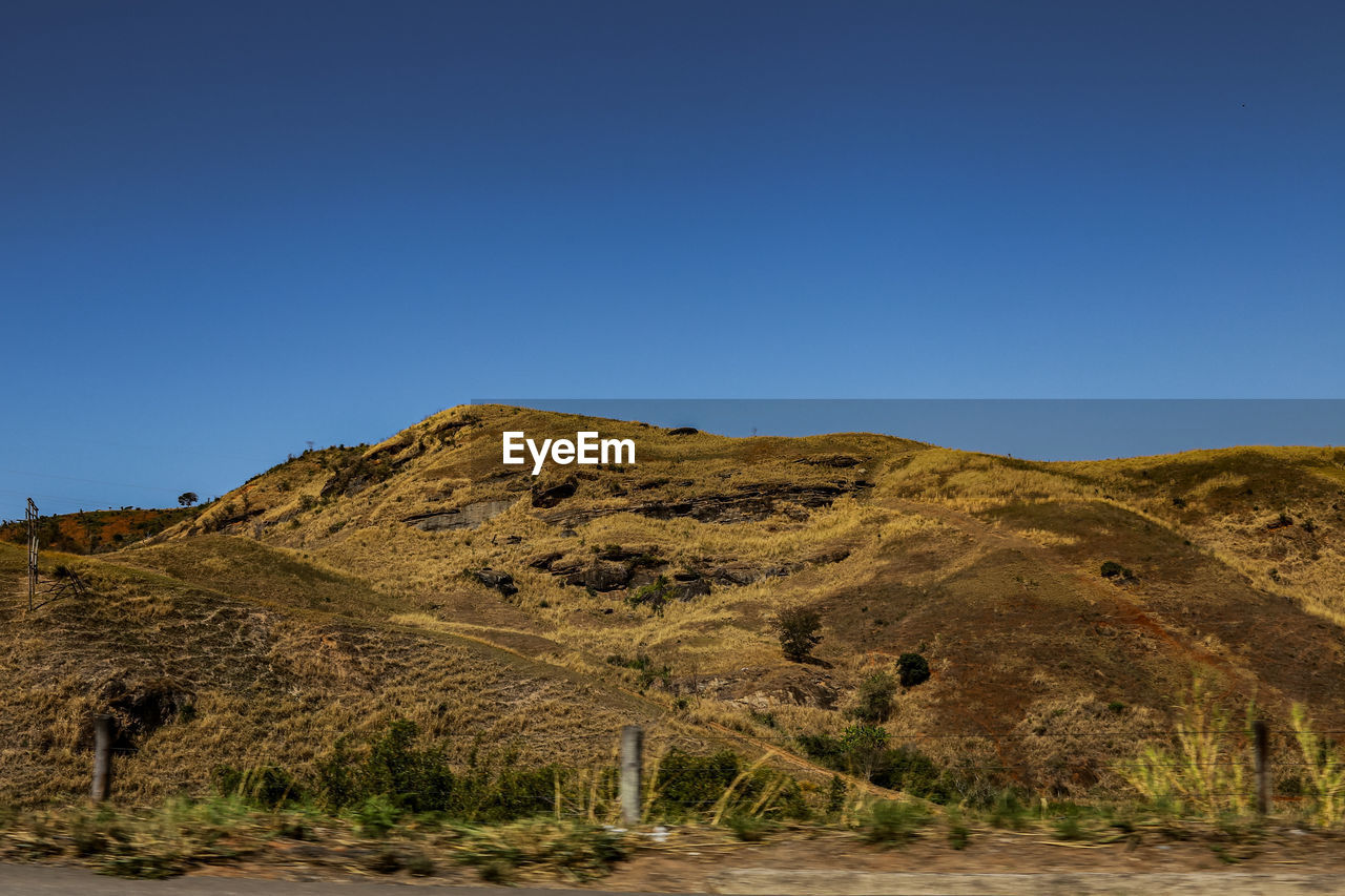 scenic view of mountain against clear blue sky