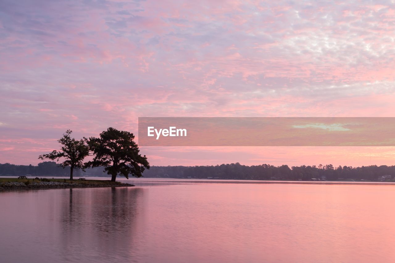 Scenic view of lake against sky during sunset