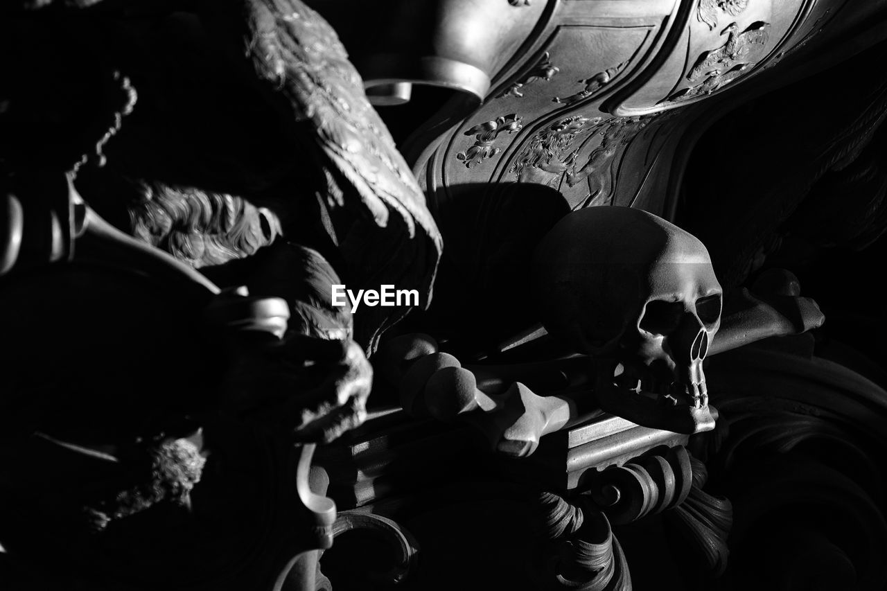 Close-up of skull on table in darkroom