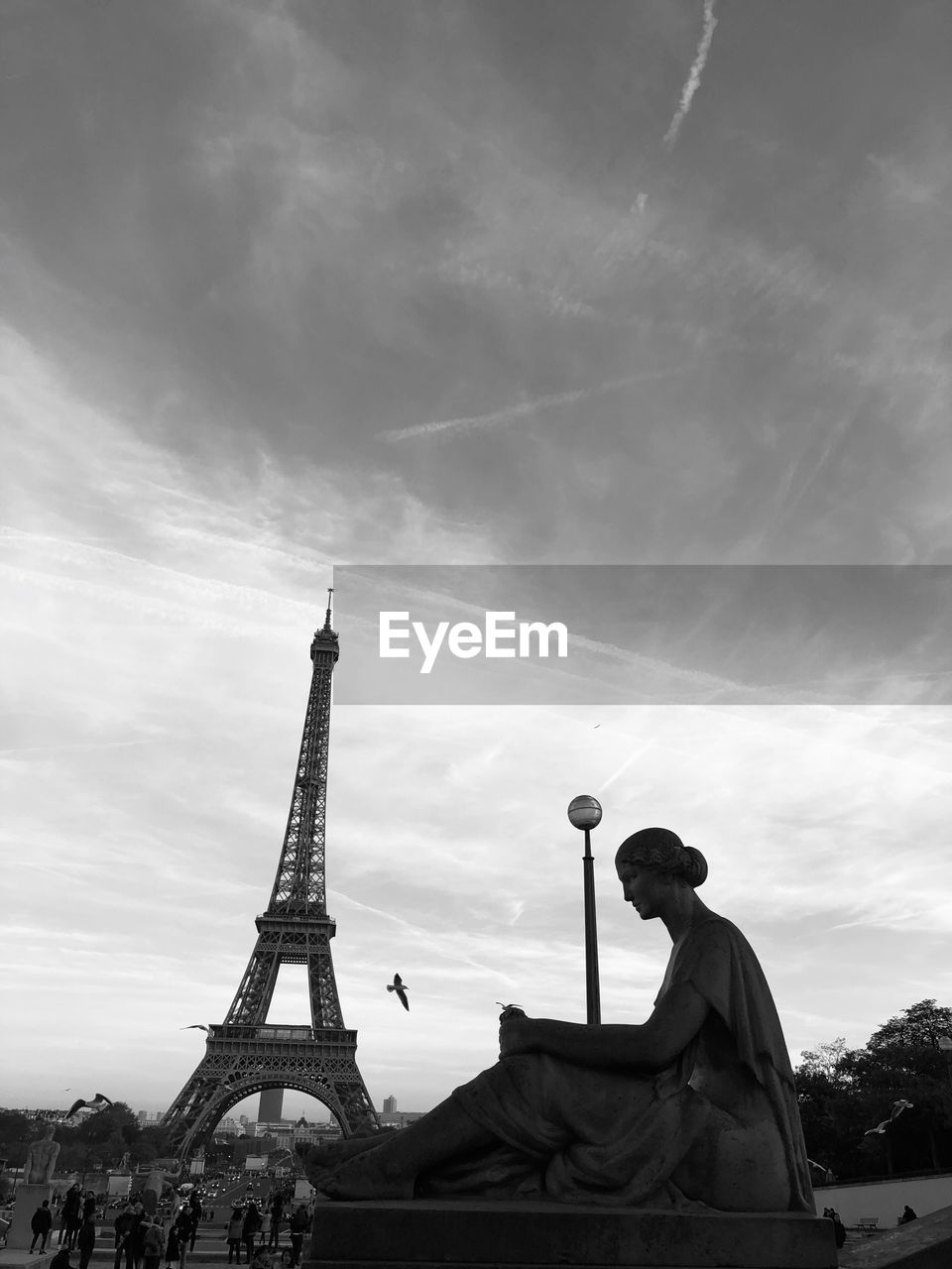 Low angle view of eiffel tower against blue sky during sunset