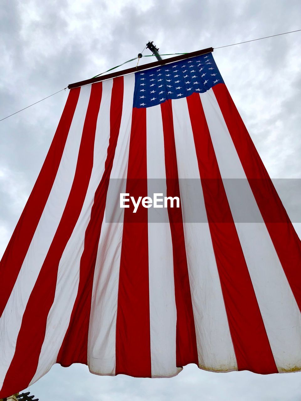 Low angle view of flag against sky