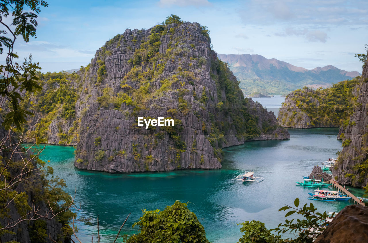 SCENIC VIEW OF ROCK FORMATIONS IN WATER