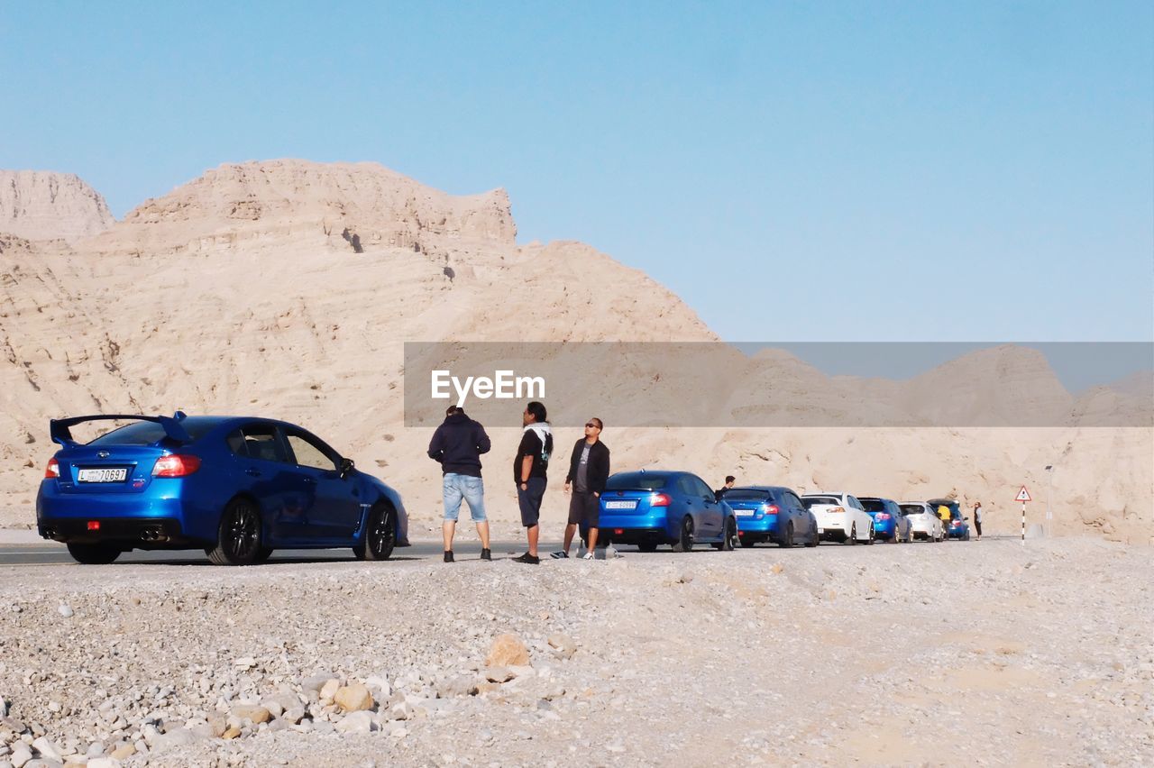 GROUP OF PEOPLE IN DESERT