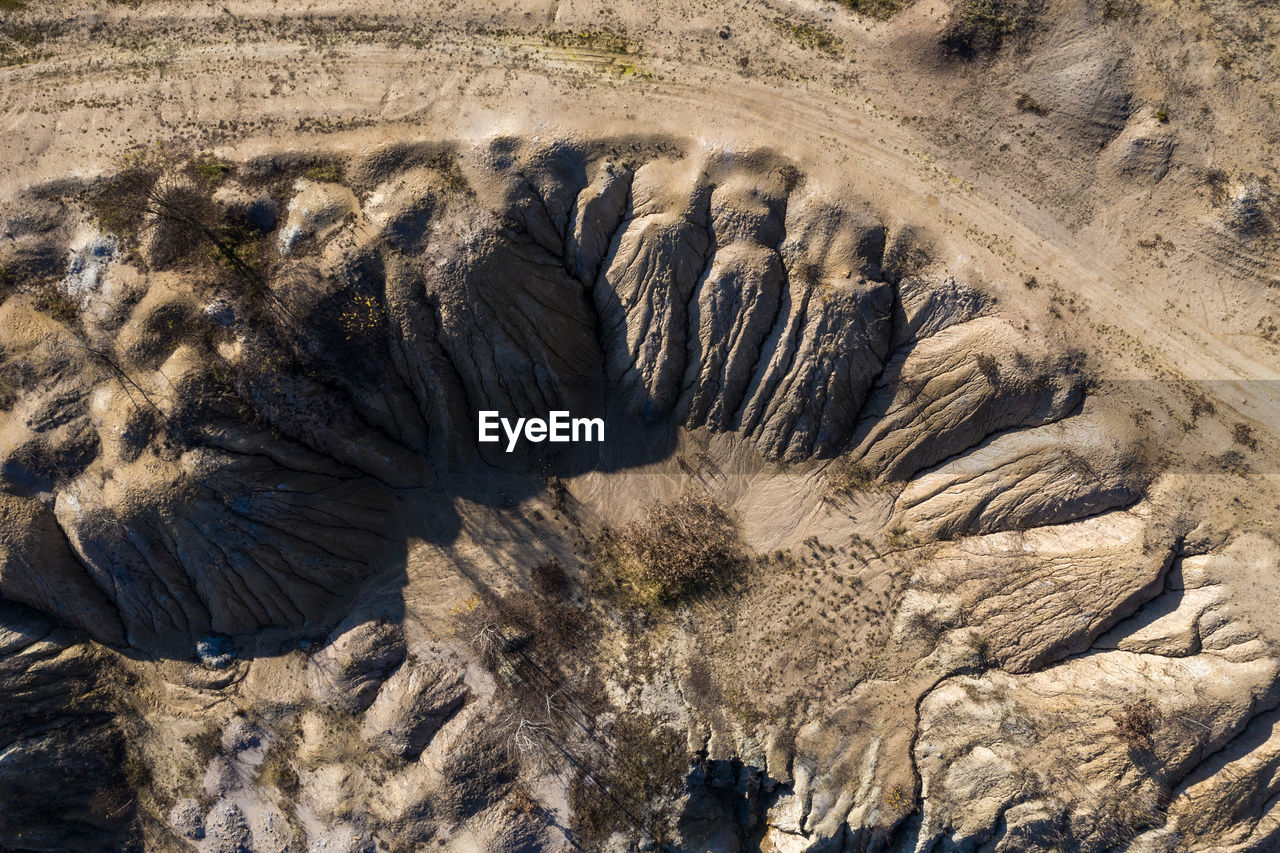 Industrial mining landscape from a drone. aerial view of abandoned open pit mine, nature pollution
