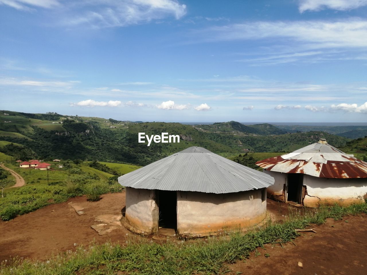 BUILT STRUCTURES ON FIELD AGAINST SKY