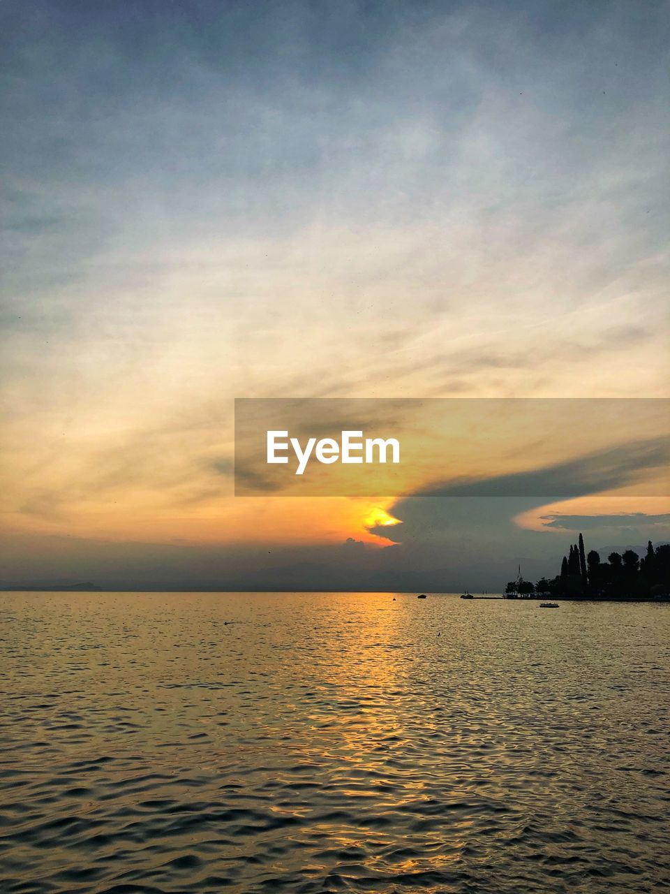 SCENIC VIEW OF SEA DURING SUNSET