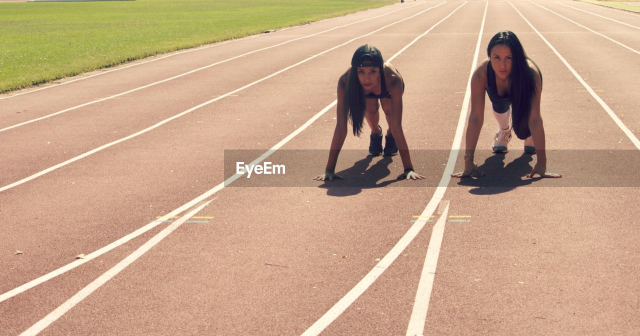 Portrait of women on running track