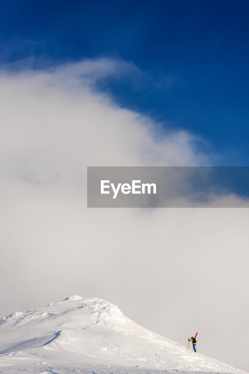 Scenic view of snowcapped mountain against sky