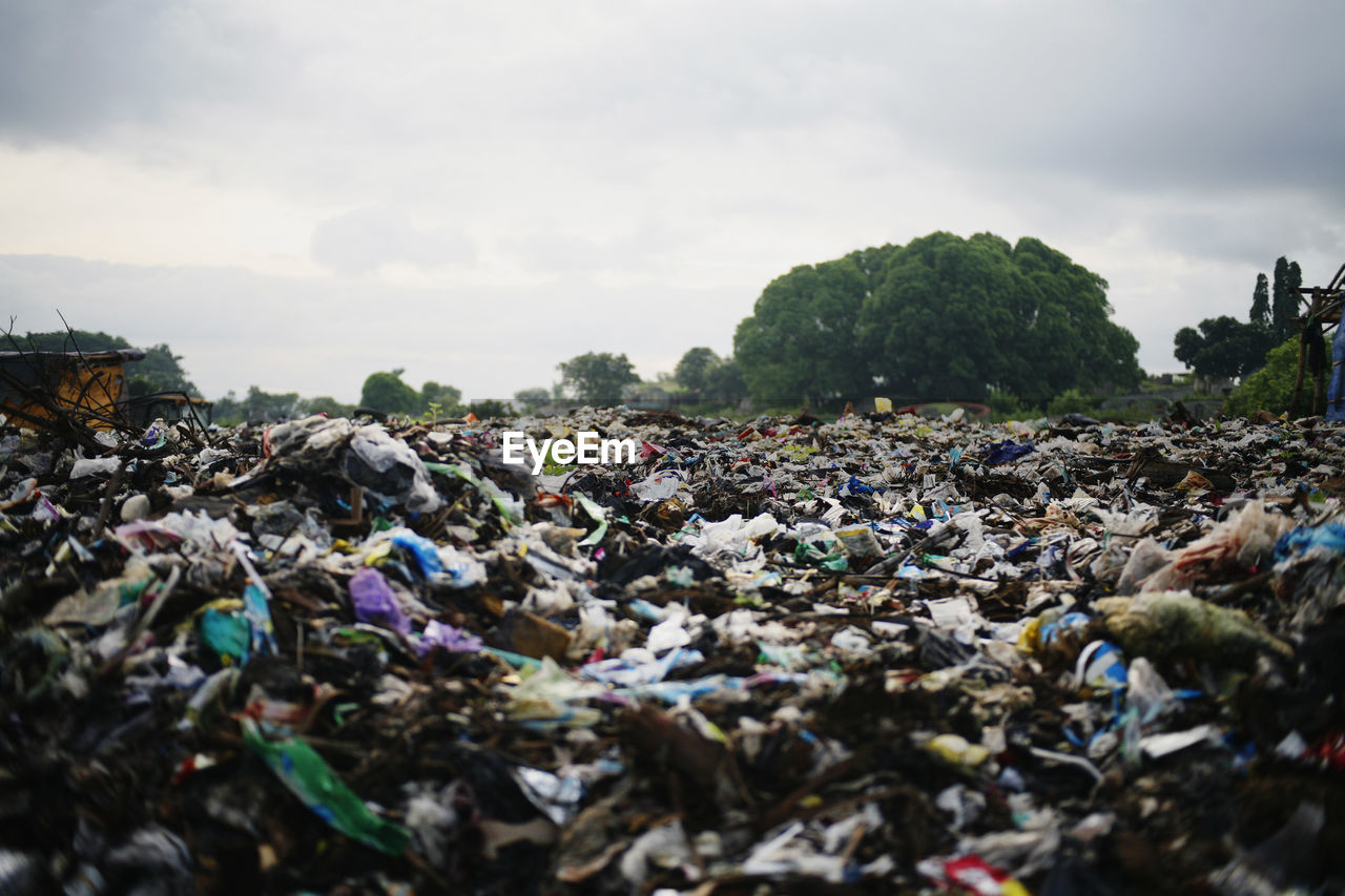 Garbage in park against sky