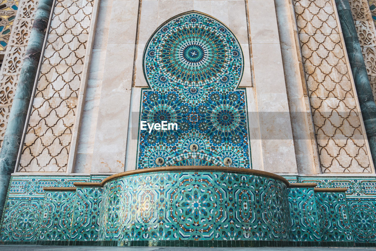 Beautiful fountain at the mosque hassan ii, water tap decorated  - casablanca, morocco