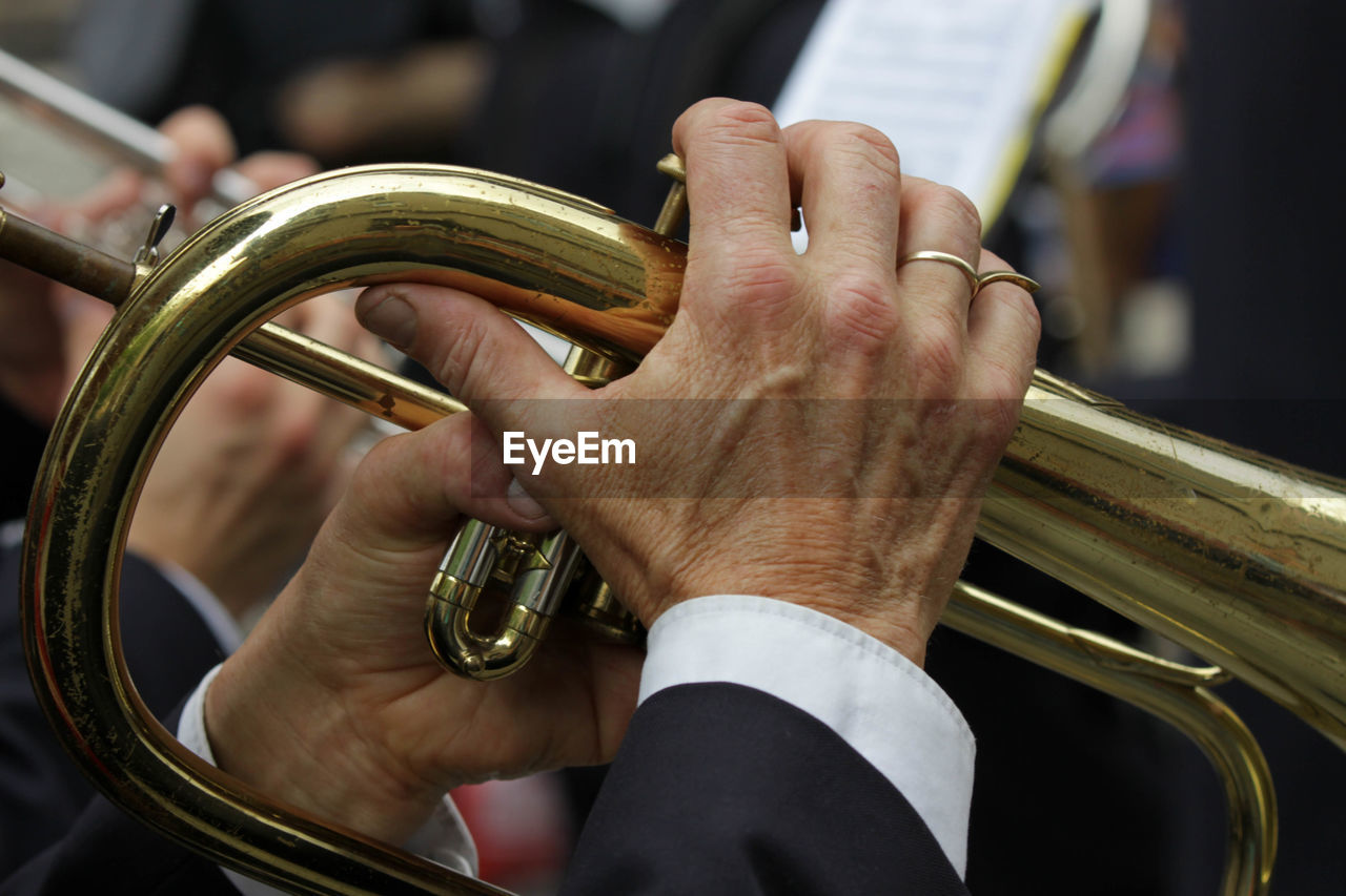 Close-up of man playing trumpet