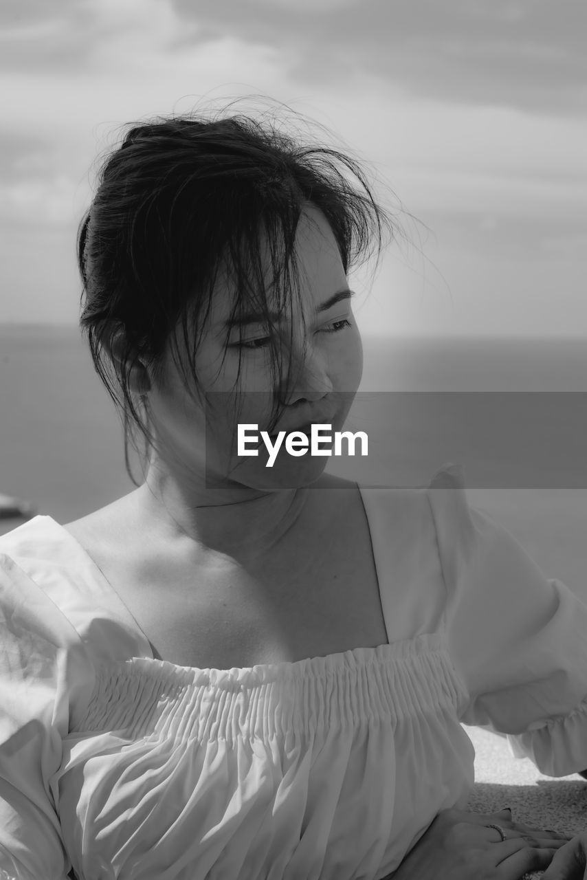 Portrait of girl on balcony at beach