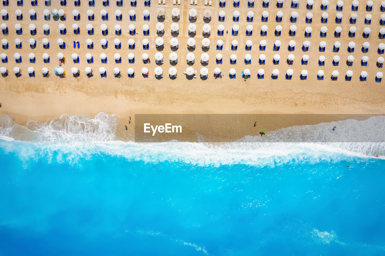 HIGH ANGLE VIEW OF SWIMMING POOL IN SEA