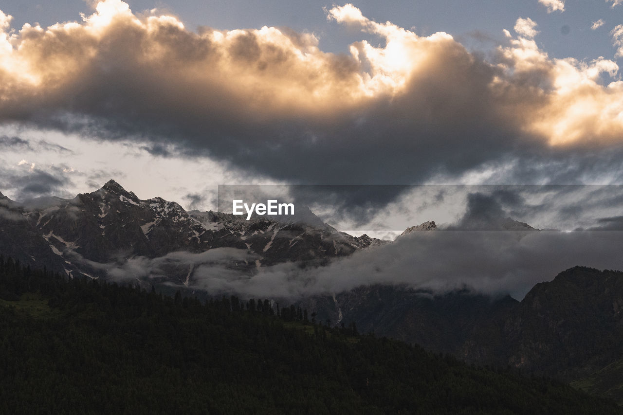 scenic view of snowcapped mountains against sky during sunset