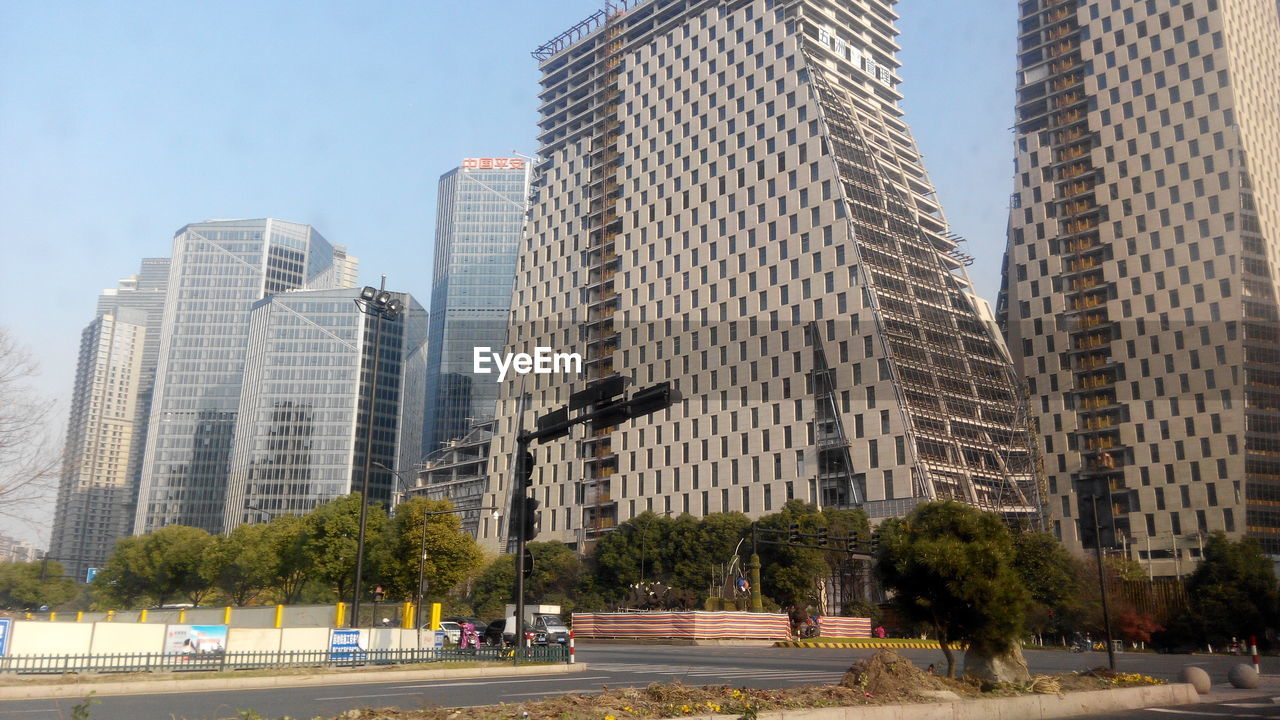 Modern buildings in city against sky