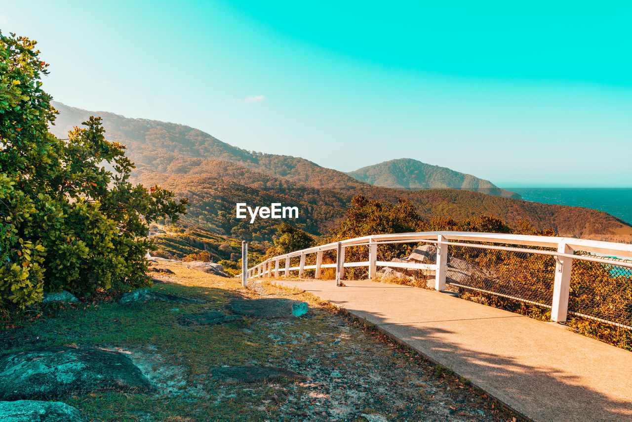 Bridge over road against sky