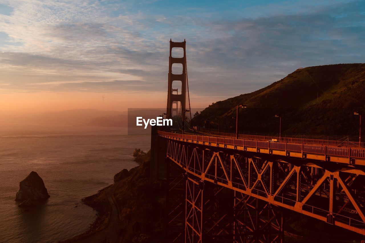 Golden gate bridge over sea against sky