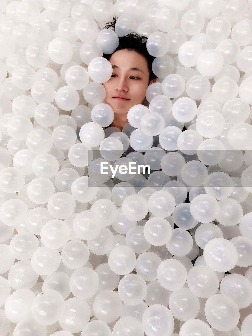 High angle view of woman in ball pool