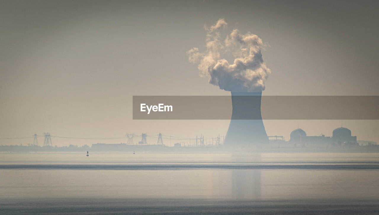 Smoke stack on the delaware river horizon. 