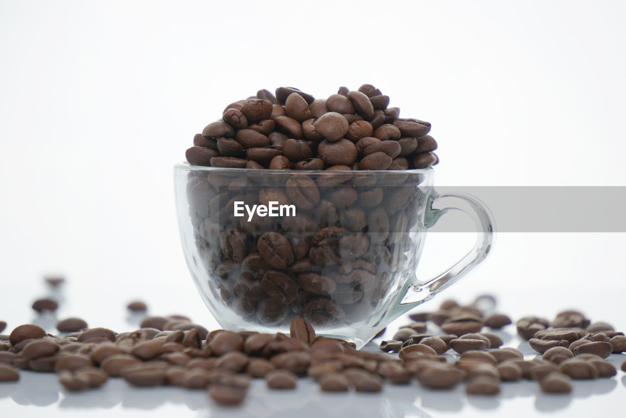 CLOSE-UP OF COFFEE BEANS IN GLASS
