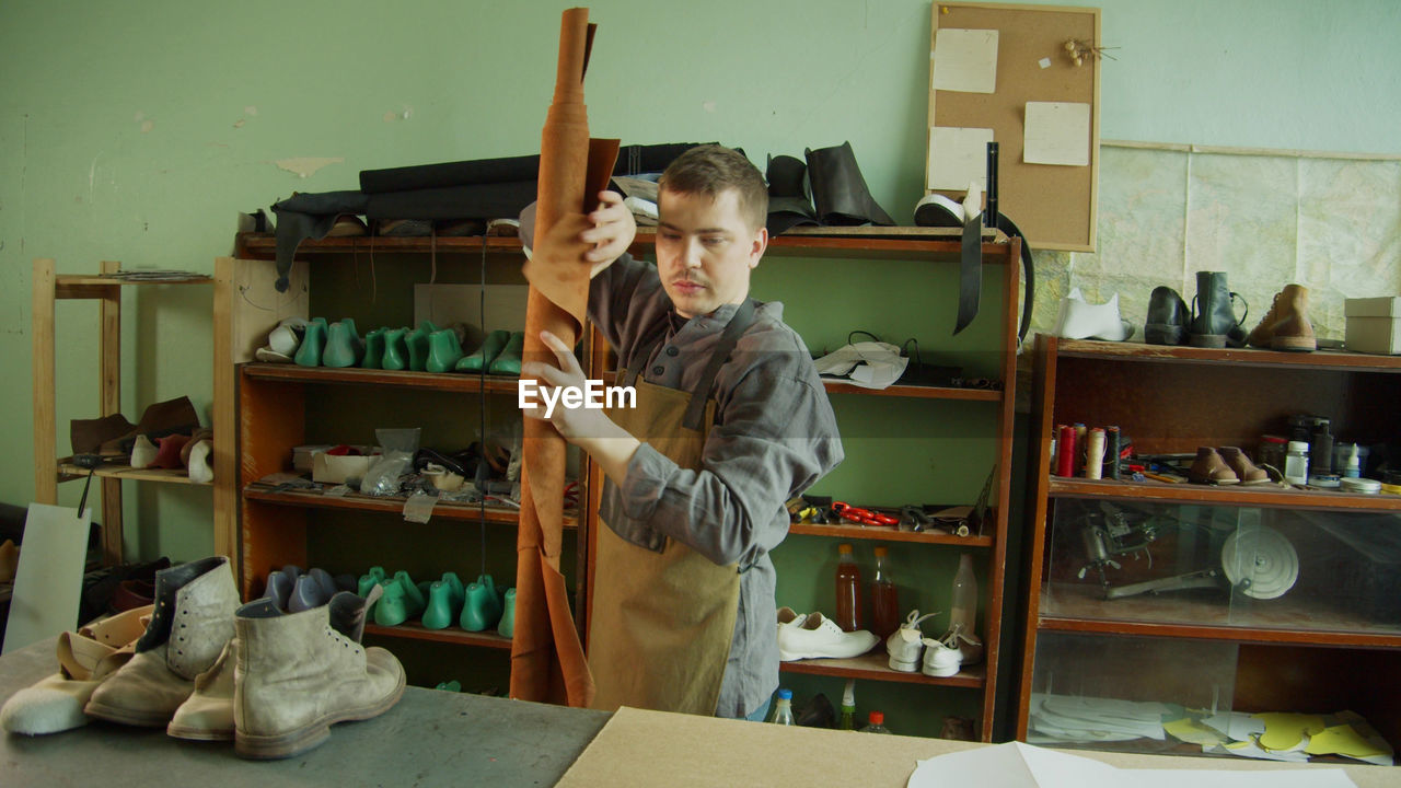 Young man working at store