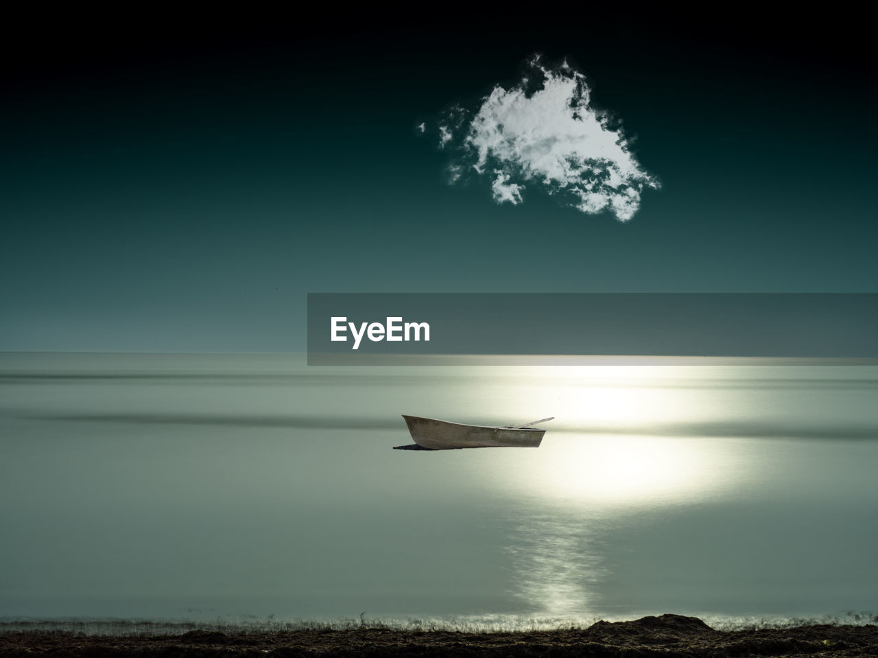 Scenic view of sea with boat against sky