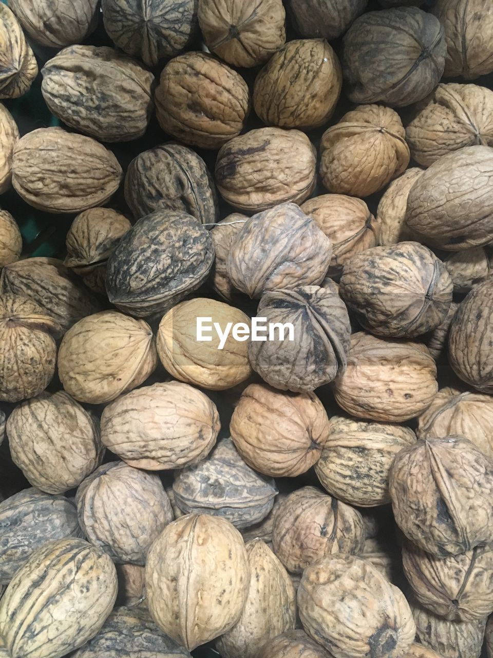 Full frame shot of walnuts for sale at market