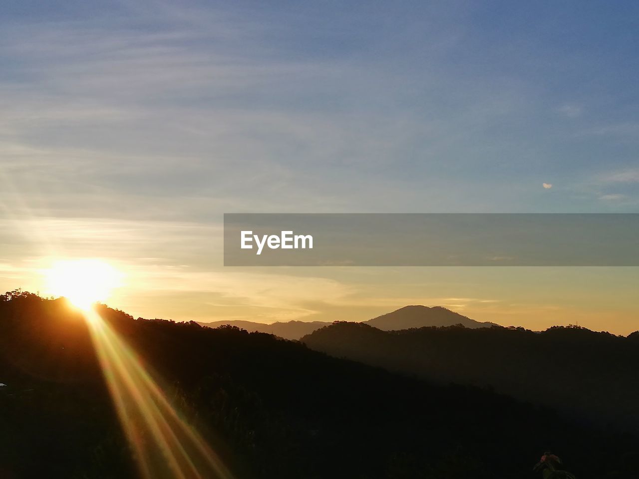 SILHOUETTE MOUNTAINS AGAINST SKY DURING SUNSET