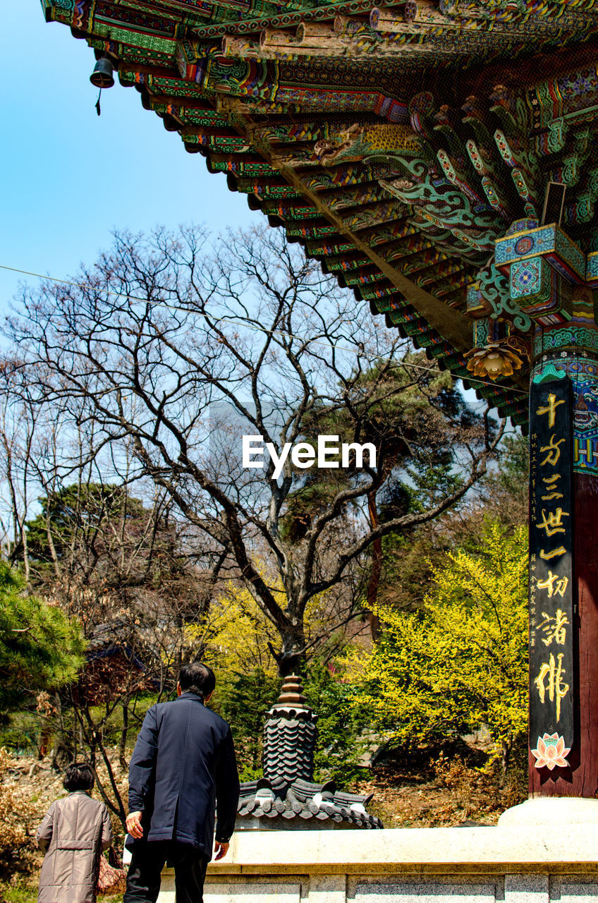 Rear view of people at temple