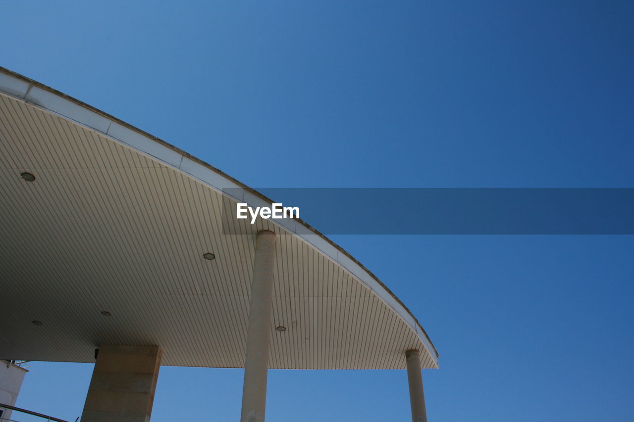 Low angle view of built structure against blue sky