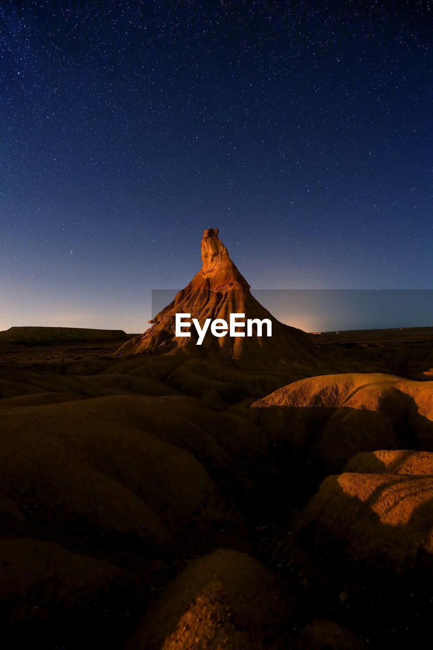 Scenic view of formation against clear sky at night